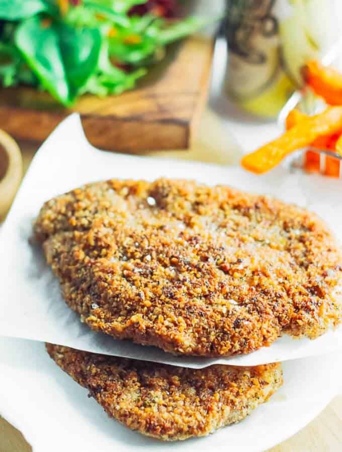 Healthy Low Carb Chicken Schnitzel close up on cutting board