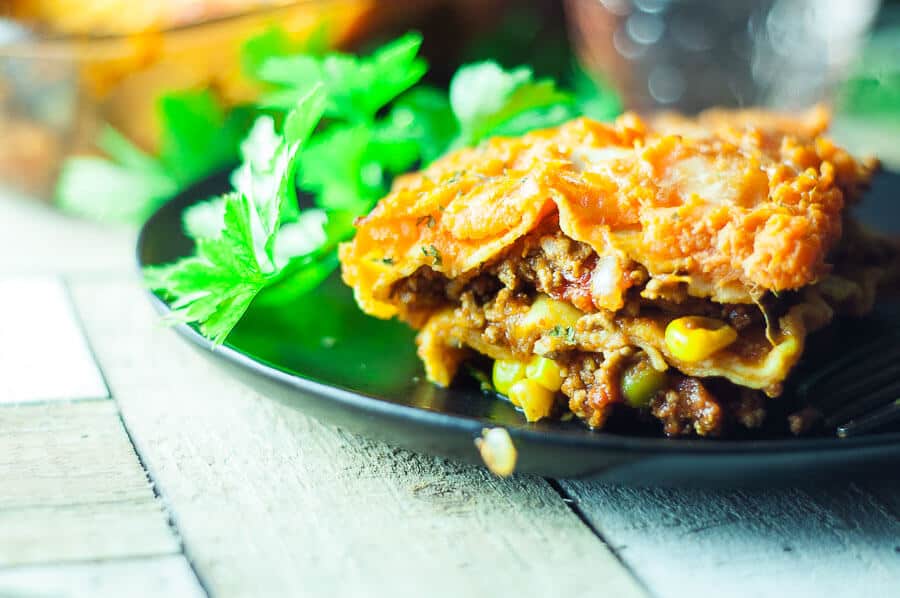 A slice of shepherds pie lasagne on a plate